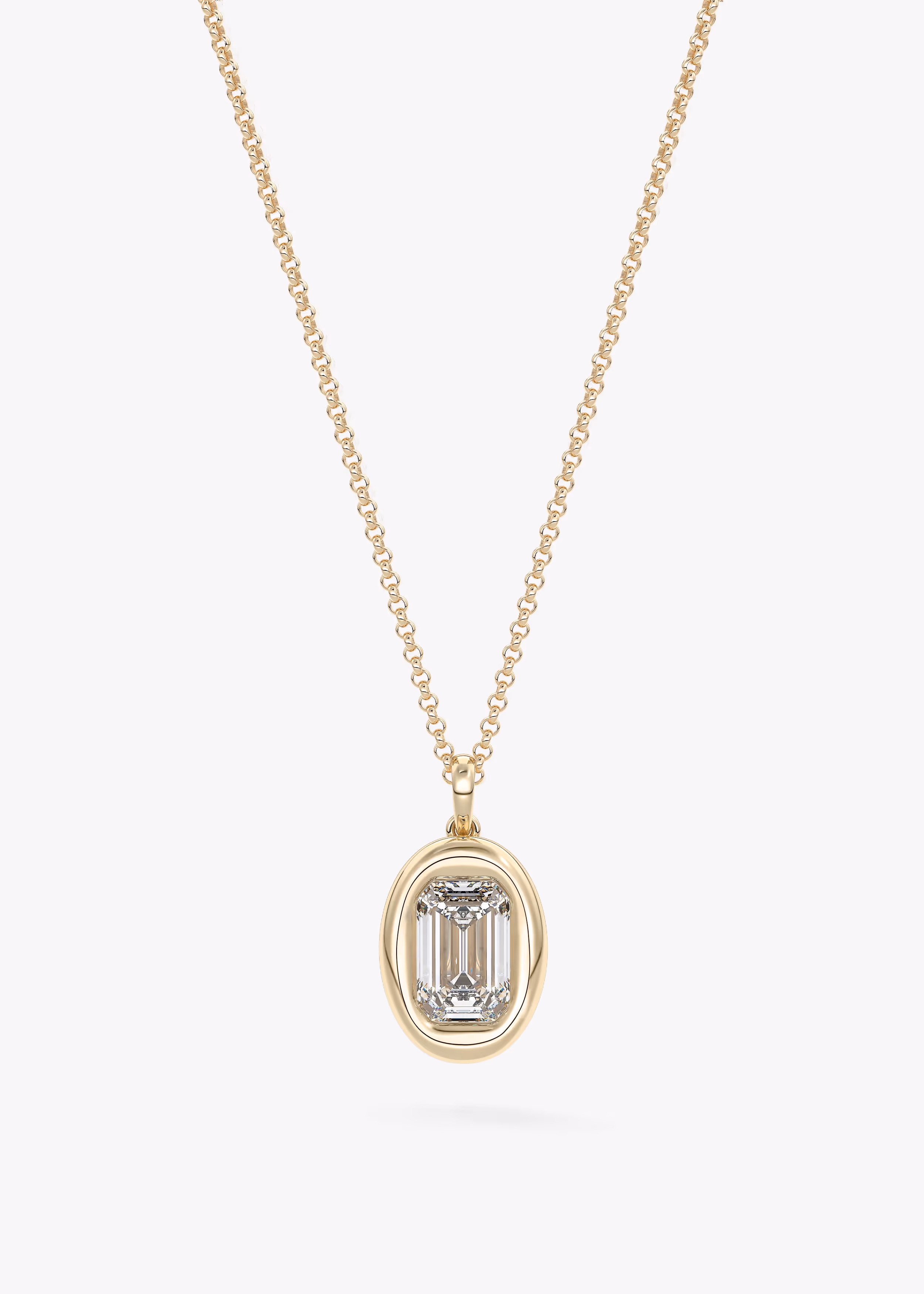 The Gumdrop necklace in YG metal featuring Emerald cut with Bezel,Emerald setting