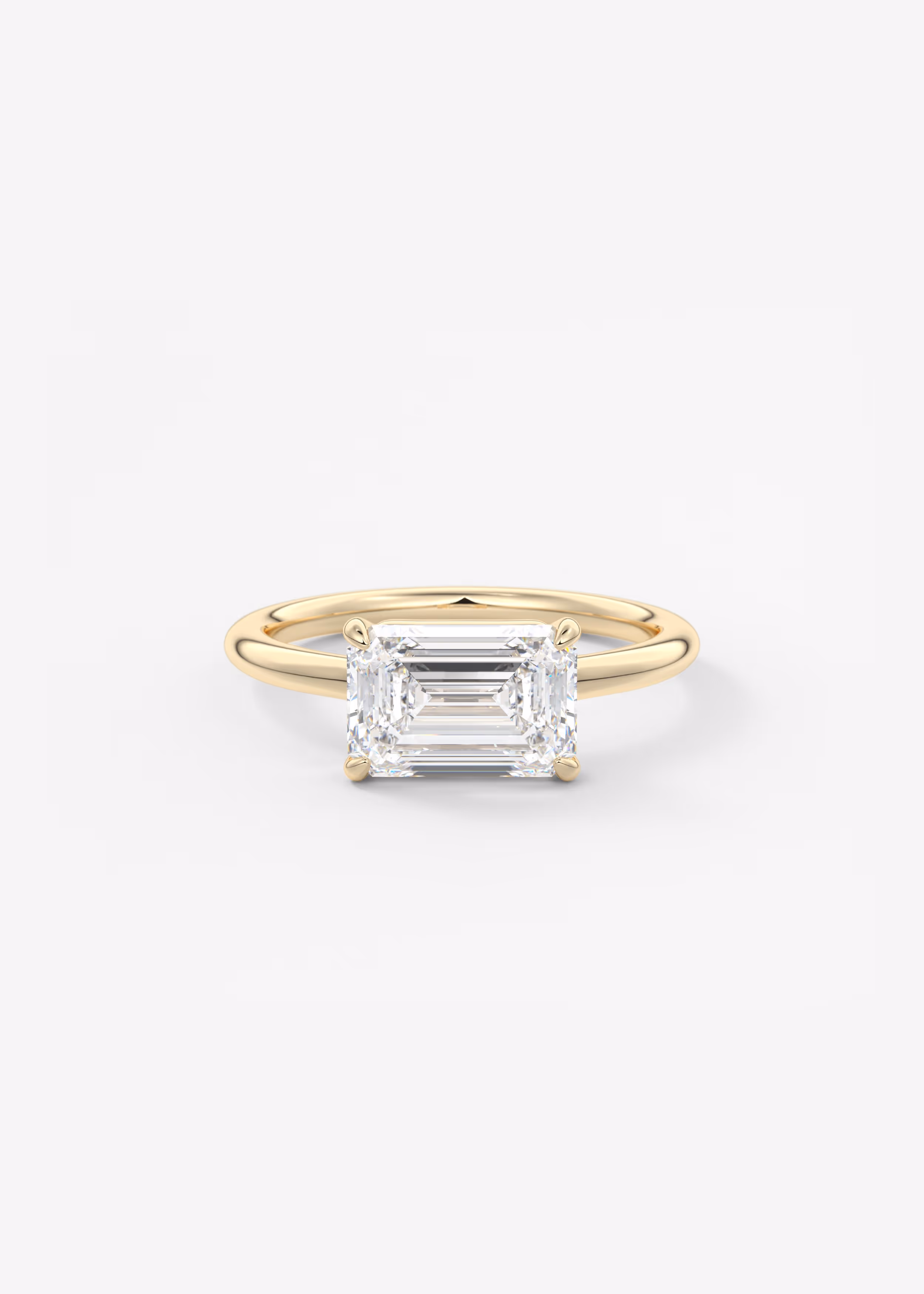 east west emerald engagement ring