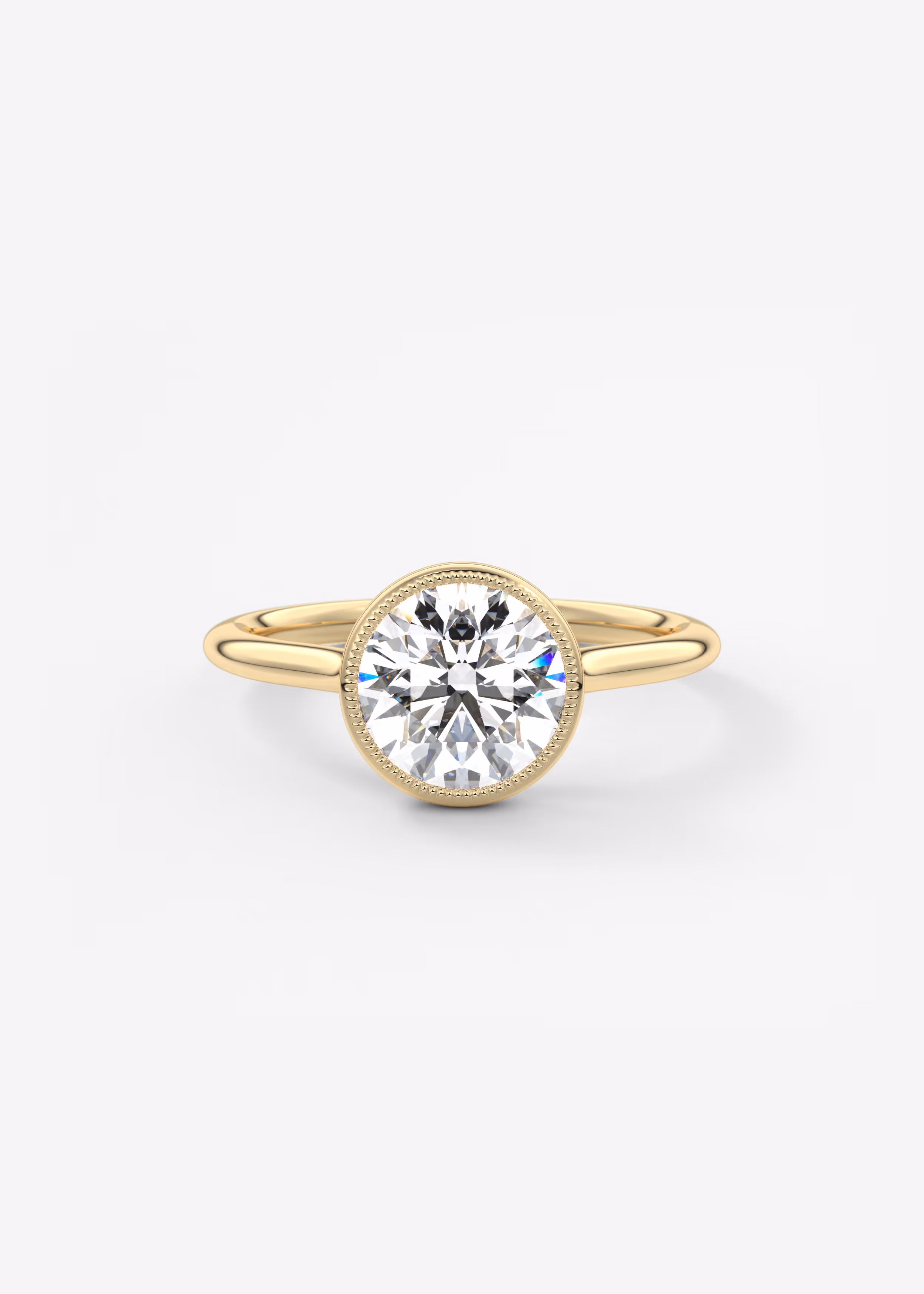 Vintage inspired round bezel set Frank Darling diamond engagement ring with millgrain detailing and a low profile trellis basket in yellow gold